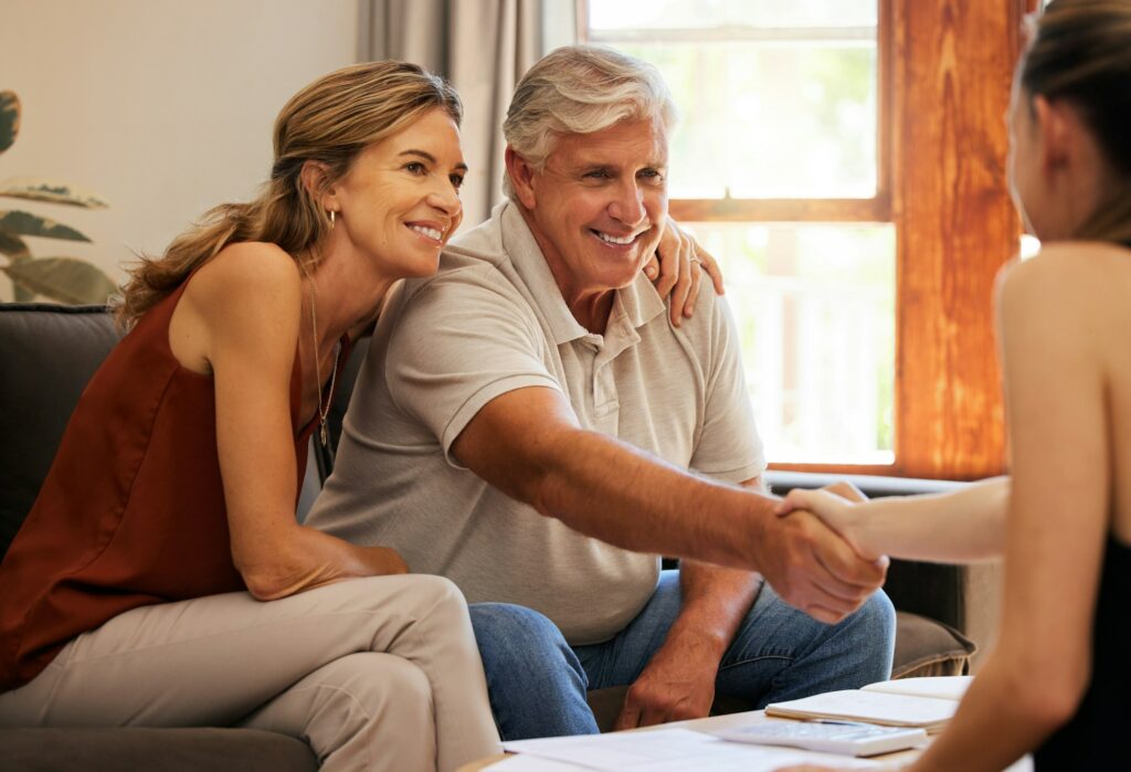 Real estate, family home and senior couple doing handshake with agent to sell house. Old man and wo